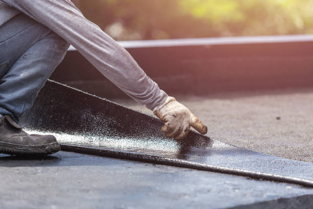 Professional Basement Waterproofing technician working in Oswego, NY